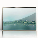 Framed acrylic print of a close-up water design in silver and blue tones.