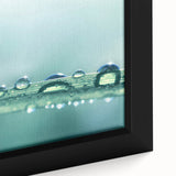 Close-up of textured black wall art featuring colorful abstract designs on a framed canvas.