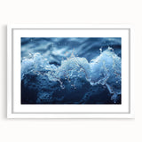Abstract art print featuring close-up water design in blue and white tones on a framed canvas.