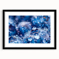 Extra large abstract art print featuring a close-up water design in vibrant blue and green hues, framed in black.