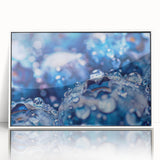 Acrylic print of water ripples in grayscale, framed in white, suitable as modern art wall decor for a nursery.