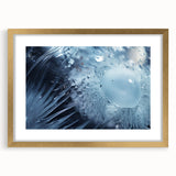 Abstract art print featuring textured waves in neutral tones, framed in gold.