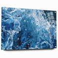 Close-up water design on acrylic glass, featuring large abstract blue and teal swirls.