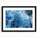 Abstract art print featuring textured, colorful patterns on a large canvas, framed in black, ideal for living room decor.