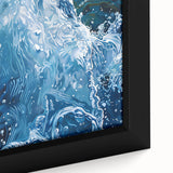 Close-up black wall art featuring colorful, textured water design on a framed canvas, ideal for living room decor.