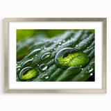 Textured art print of abstract ripples in muted blue and gray, framed in silver, ideal for bedroom wall decor.