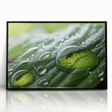 Large abstract wall art depicting water ripples in muted blue and gray tones, framed in black acrylic.