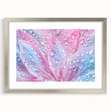 Close-up textured art print of water ripples in shades of blue and gray, framed in silver, suitable for bedroom art.