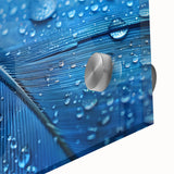 Large abstract wall art in acrylic glass featuring close-up water design with blue and teal tones.