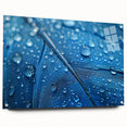 Close-up view of water ripples on large abstract acrylic wall art in muted blue tones.