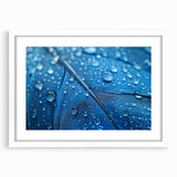 Abstract art print featuring swirling blue and teal patterns on a white framed canvas, ideal for modern dining room decor.