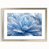 Textured abstract art print in muted blue and gray, framed in silver, ideal for bedroom wall decor.