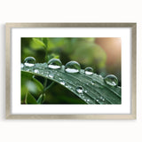 Textured abstract art print featuring swirling blue and gray patterns on a silver-framed canvas, suitable for bedroom decor.