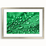 Textured art print of abstract water design in silver frame, featuring cool blue and gray tones.