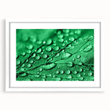 Abstract art print featuring close-up water design in muted blue and white tones, framed with a white mat.