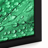 Black wall art featuring a close-up of water with a colorful, textured design on a framed canvas.