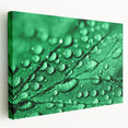 Close-up image of water droplets on a leaf, in cool blue tones on a large stretched canvas, suitable for kitchen wall art.