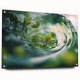 Large abstract wall art depicting water ripples in muted blue tones, printed on acrylic glass.