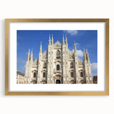 Textured abstract art print of a cathedral, featuring gold and beige tones on a framed mat, ideal for bedroom art.