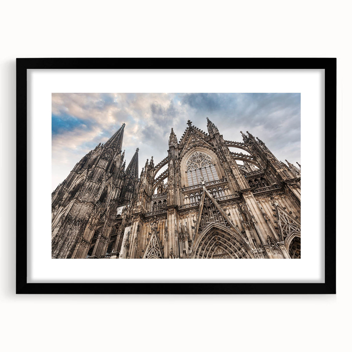 Abstract art print of a cathedral, featuring vibrant multicolor textures on a large black framed canvas.
