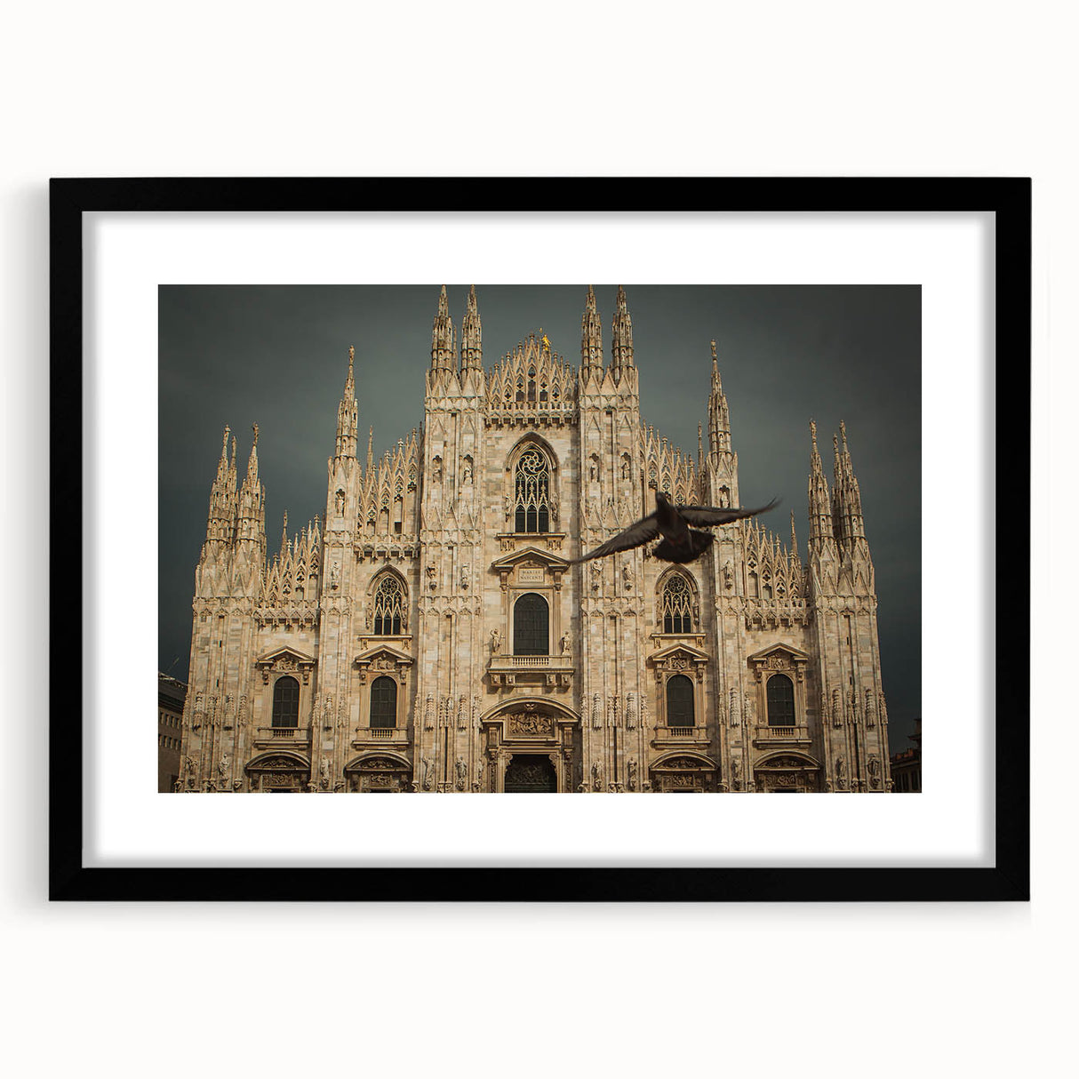 Abstract art print featuring a colorful, textured depiction of a cathedral, presented in a large black frame with mat.
