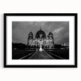 Extra large abstract art print of a colorful, textured cathedral, ideal for living room decor, framed with a black mat.