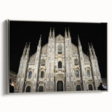 Vintage poster art of a cathedral, in colorful hues on a black background, presented as a framed canvas.