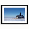Abstract art print depicting a colorful, textured church design in vibrant hues on a large framed canvas.