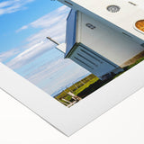 Art deco poster of a stylized church design in muted gold and black, printed on rolled canvas.