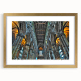 Textured abstract art print of an indistinct church design in muted gold and white, framed with a gold mat.