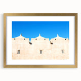 Textured abstract art print of a mosque in gold and beige tones on a framed mat, suitable for bedroom art.