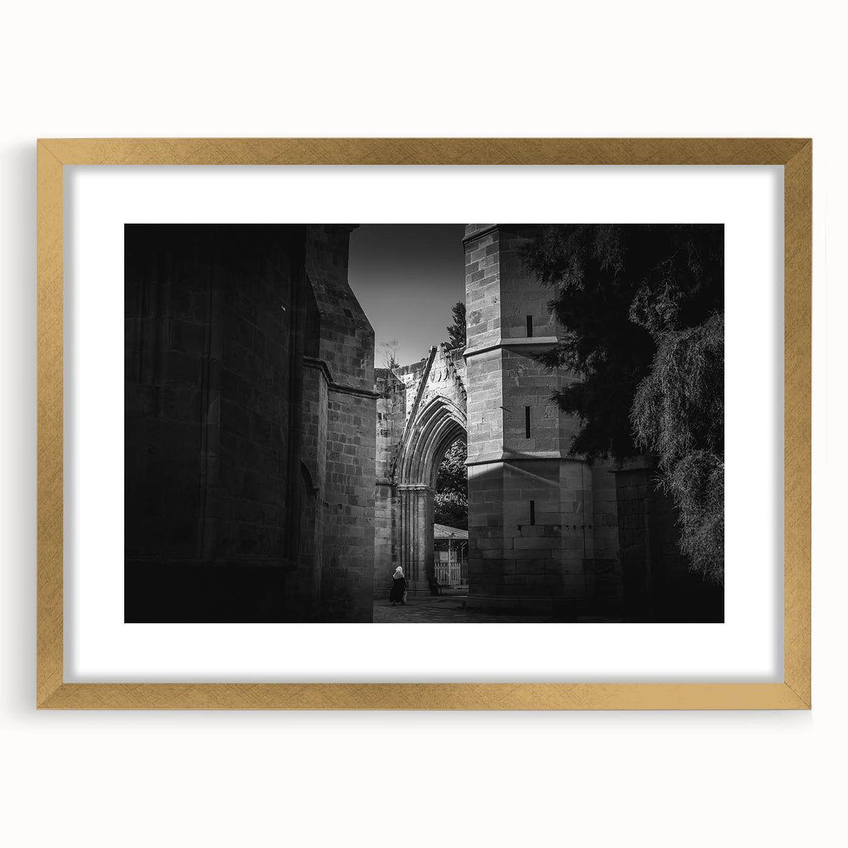 Textured abstract art print of a mosque in muted gold and beige tones on a framed canvas, suitable for bedroom decor.