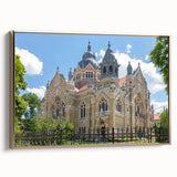 Framed canvas depicting a vintage synagogue in a landscape setting, featuring a gold and black color palette.