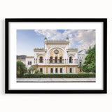 Abstract art print of a colorful, textured synagogue design in a large black frame, ideal for living room decor.