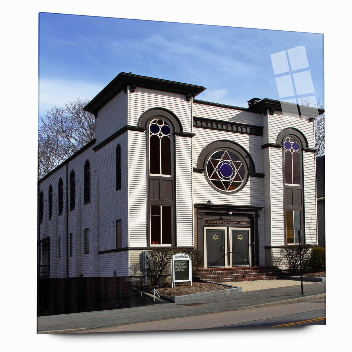 Large abstract wall art featuring a synagogue design in muted gold and white tones on acrylic glass.