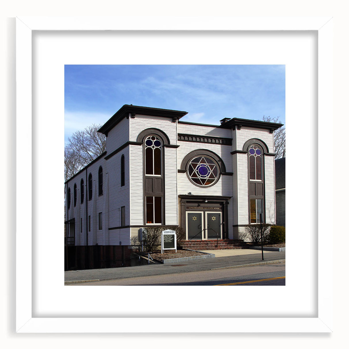 Extra large abstract art print of a textured synagogue design in muted earth tones, framed with a white mat.