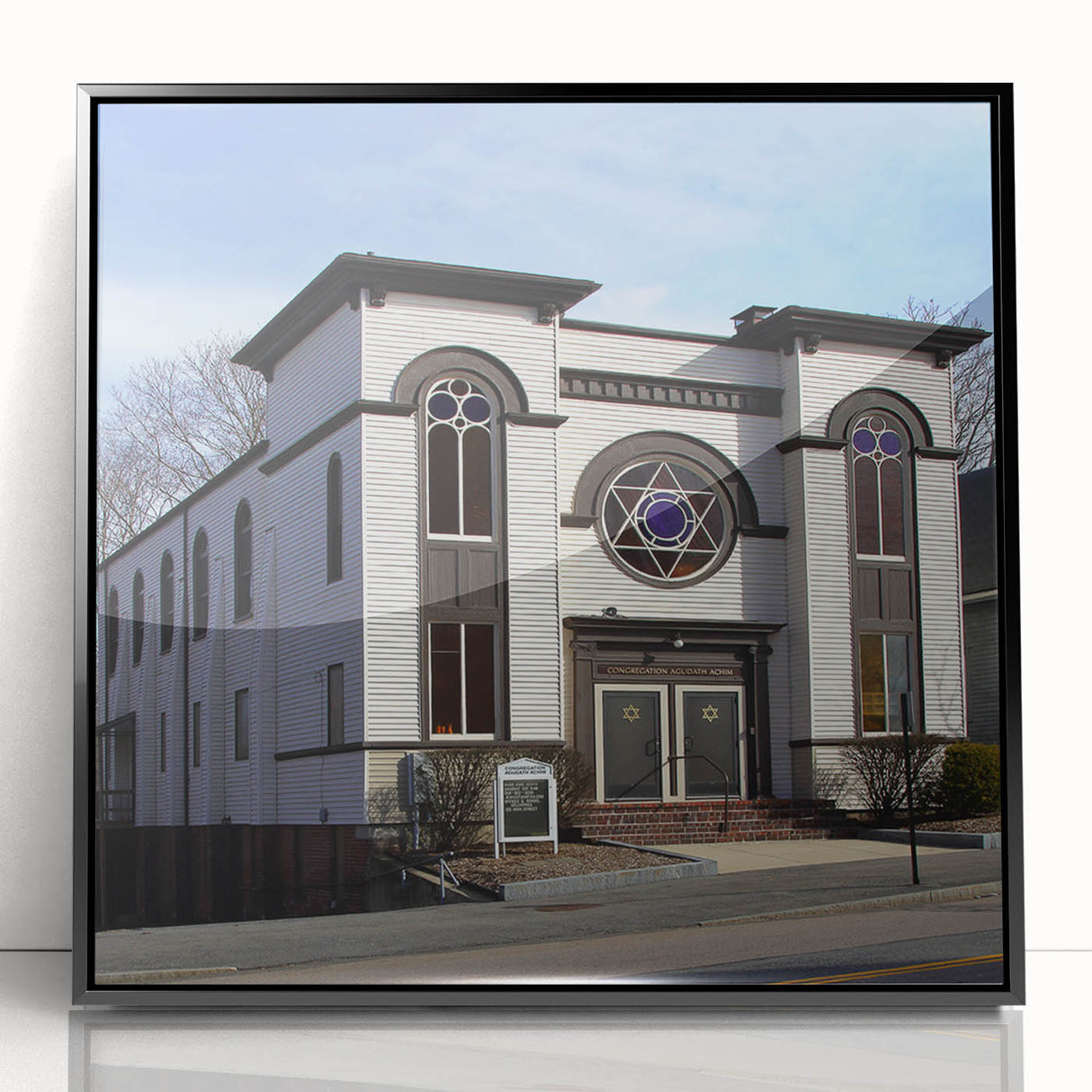 Large abstract wall art of a synagogue in mid-century modernist style, with muted gray and blue tones on a framed acrylic.