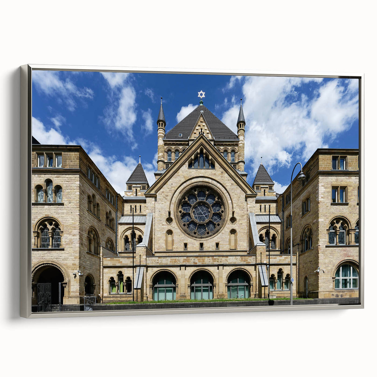 Framed canvas featuring a vintage poster art of a synagogue in muted silver and black tones, ideal for living room decor.
