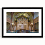 Abstract art print of a colorful, textured synagogue design on a large black-framed canvas, ideal for living room decor.