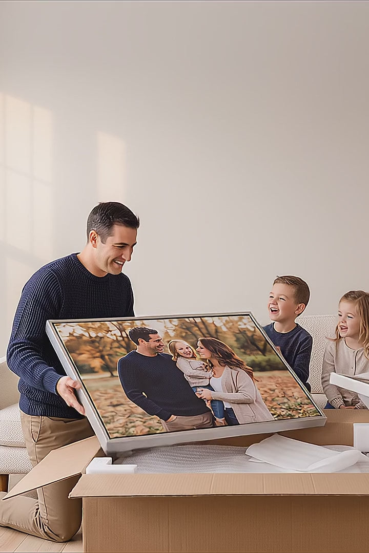 Family hanging a gallery wall of custom framed canvas photo prints above their sofa