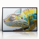 Framed wall art featuring a vibrant chameleon design in shades of green and blue, set against a sleek black frame, ideal for reptile enthusiasts and modern decor.