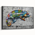 Framed wall art featuring a vibrant chameleon design on canvas, showcasing intricate colors and textures, set against a sleek black frame for modern decor.