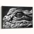 Framed canvas wall art depicting a stylized design of reptiles, specifically gators and crocodiles, in vibrant colors. The artwork is set against a sleek black background, enhancing its striking visual appeal. Ideal for reptile enthusiasts and home decor.