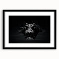 Framed wall art featuring a striking design of reptiles, including alligators and crocodiles, set against a vibrant backdrop with a sleek black frame and mat.