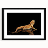 Framed wall art featuring a vibrant reptile lizard design in black and green tones, perfect for home decor or nature-themed spaces. This artwork enhances any room with its unique visual appeal and intricate details.