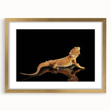 Framed wall art featuring a vibrant lizard design on a textured mat, set in a stylish gold frame, perfect for reptile enthusiasts and modern decor.