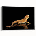 Framed wall art showcasing a striking lizard design on a black background, perfect for reptile enthusiasts, adding a modern touch to any room decor.