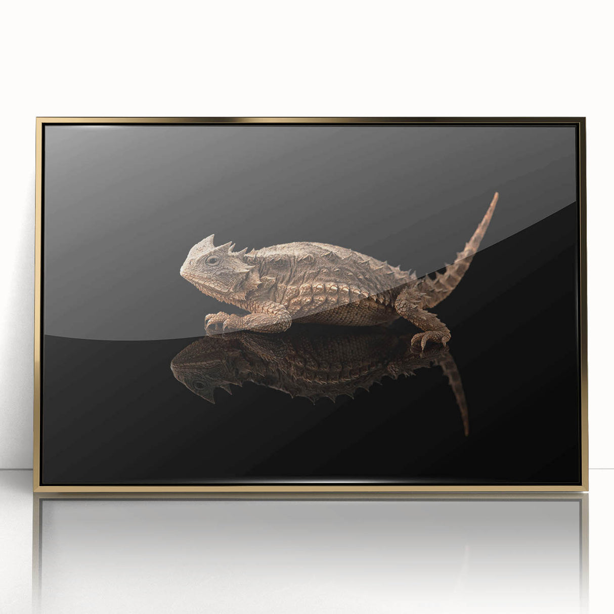 Framed wall art showcasing a vibrant lizard design with intricate details and a stylish gold frame, perfect for reptile lovers and modern home decor.