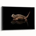 Framed wall art showcasing a vibrant reptile and lizard design on canvas, featuring a sleek black frame, perfect for adding a unique touch to modern decor.