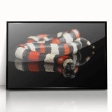 Framed wall art showcasing a striking snake design with intricate details, featuring a black frame and glossy acrylic finish, perfect for reptile enthusiasts.